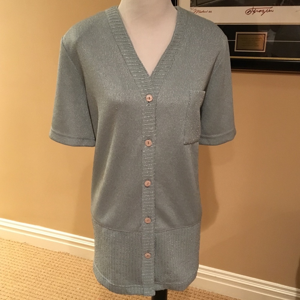 Beautiful shimmery sweater, pocket on bottom front